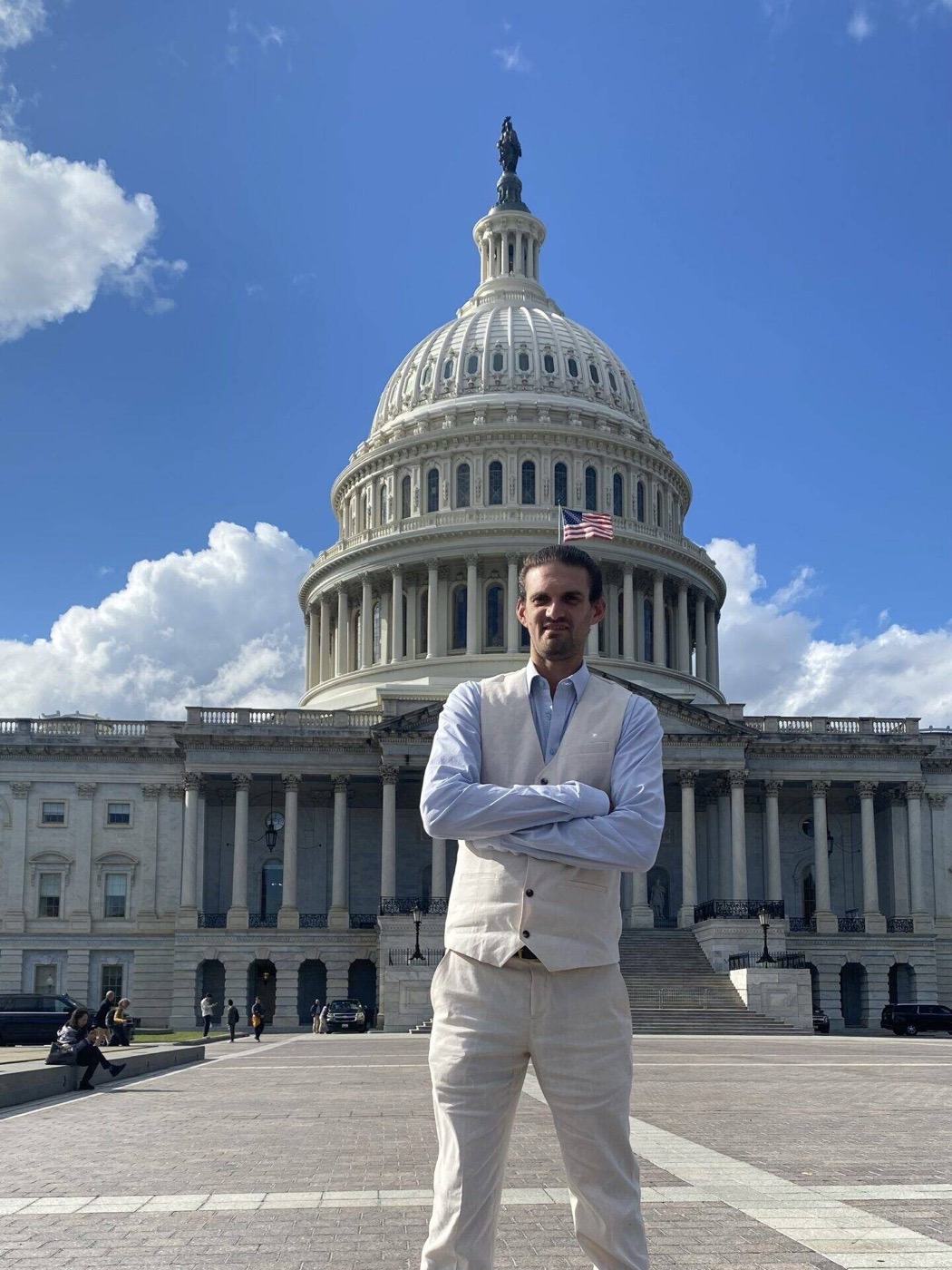 Sam Friedman, founder of Full Value Potential, standing with arms crossed at the U.S. Capitol