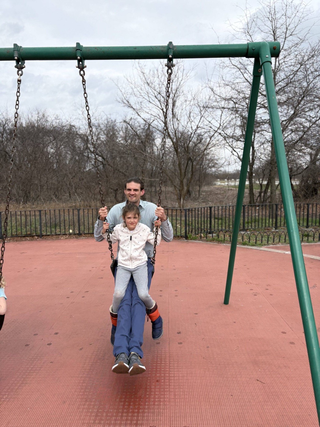 Sam with his daughter at the playground